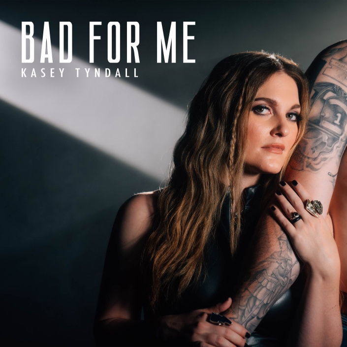 Kasey Tyndall Rocks Out In Relatable New Single"Bad For Me" 1 Kasey Tyndall poses on the album cover of her song "Bad For Me"