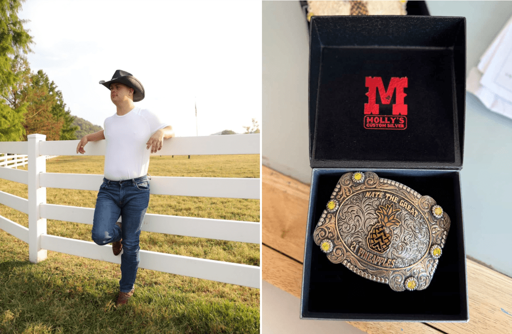 Nate Simon by a white fence in jeans and cowboy hat beside his custom Molly’s Silver belt buckle
